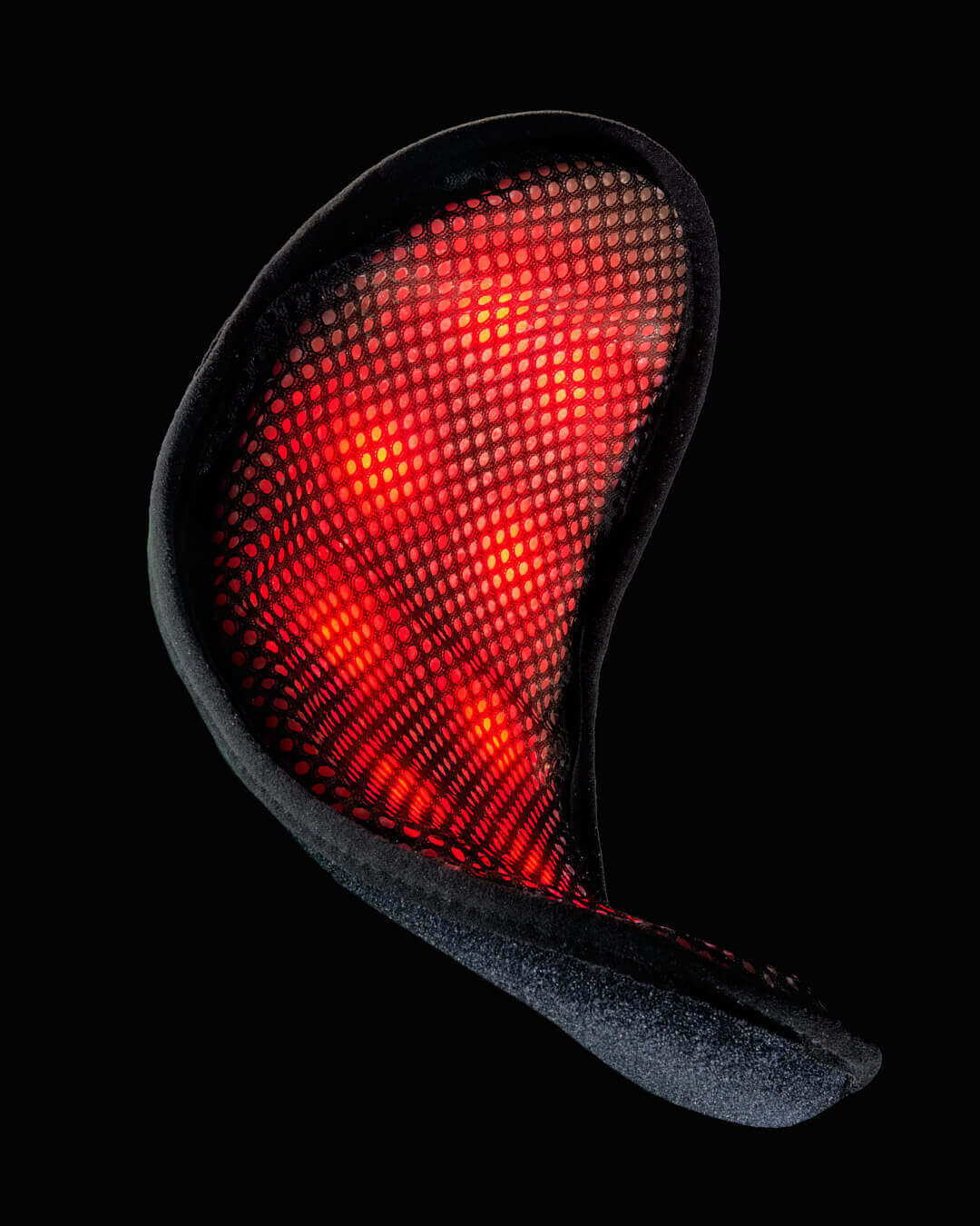 DNAVibe Jazz Band wearable device glowing with red light therapy panels