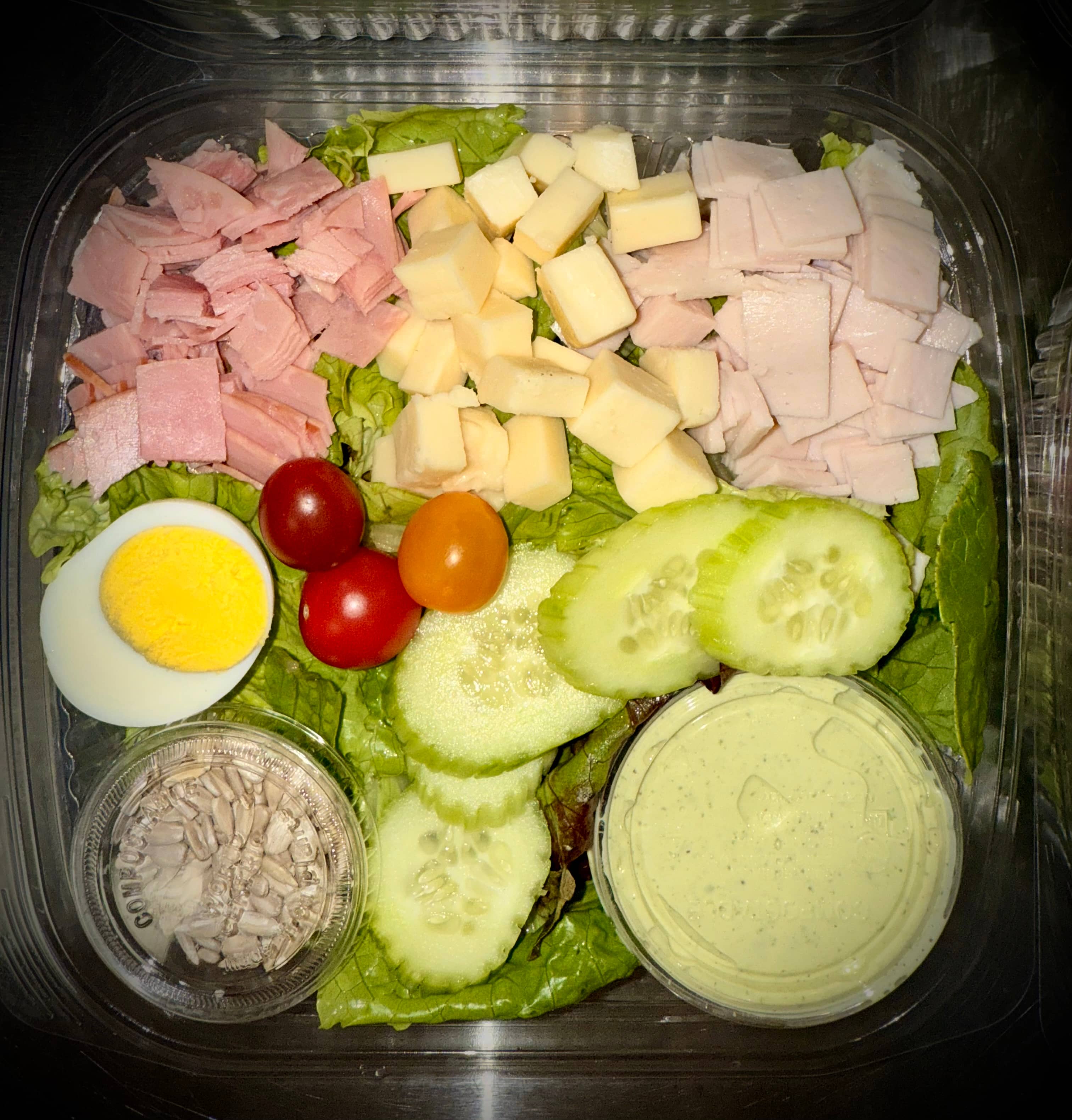Ham and turkey house salad prepared fresh at the Roosters wellness bar